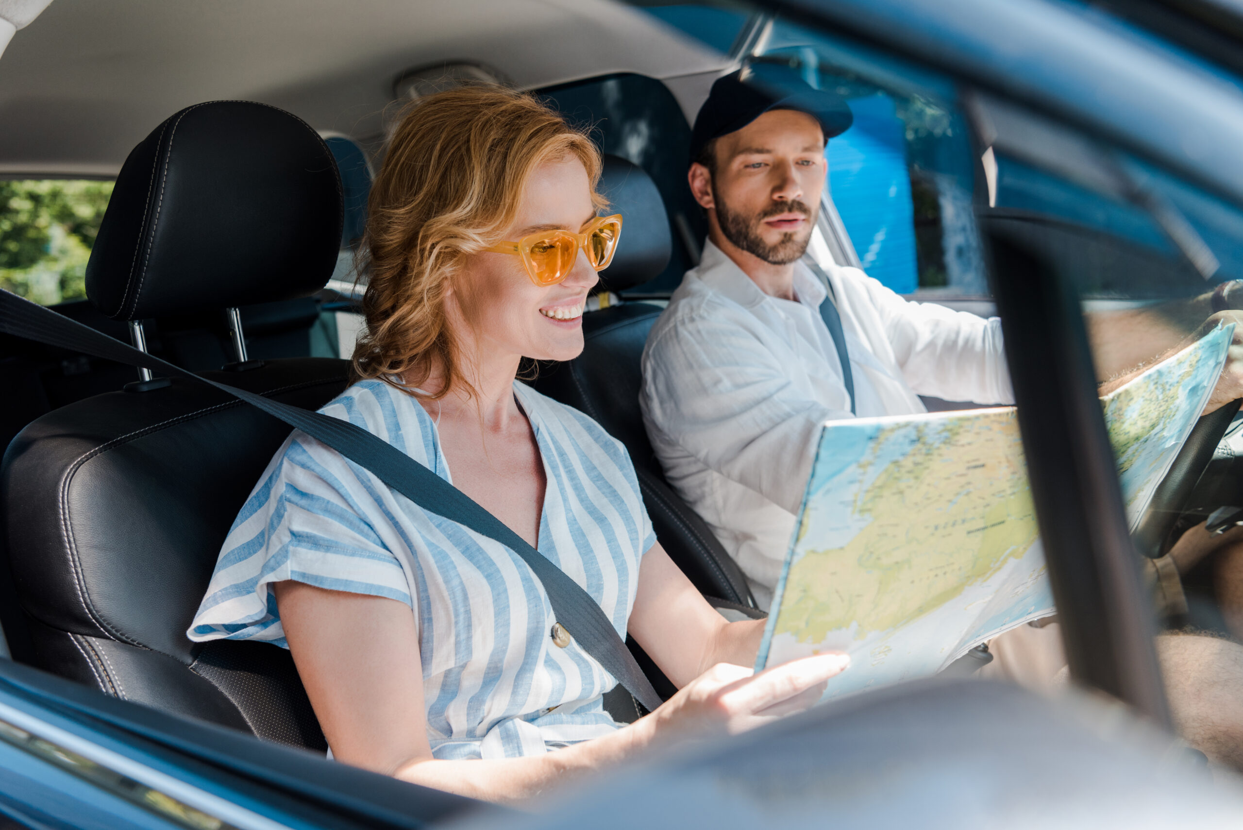 Image of parents holding a map in the car navigating parenthood in Coral Springs, FL