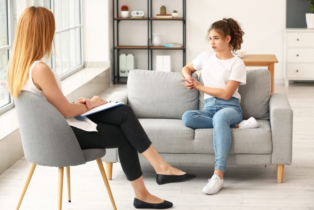 Image of a two people depicting therapy for teenagers in Coral Springs, Florida.